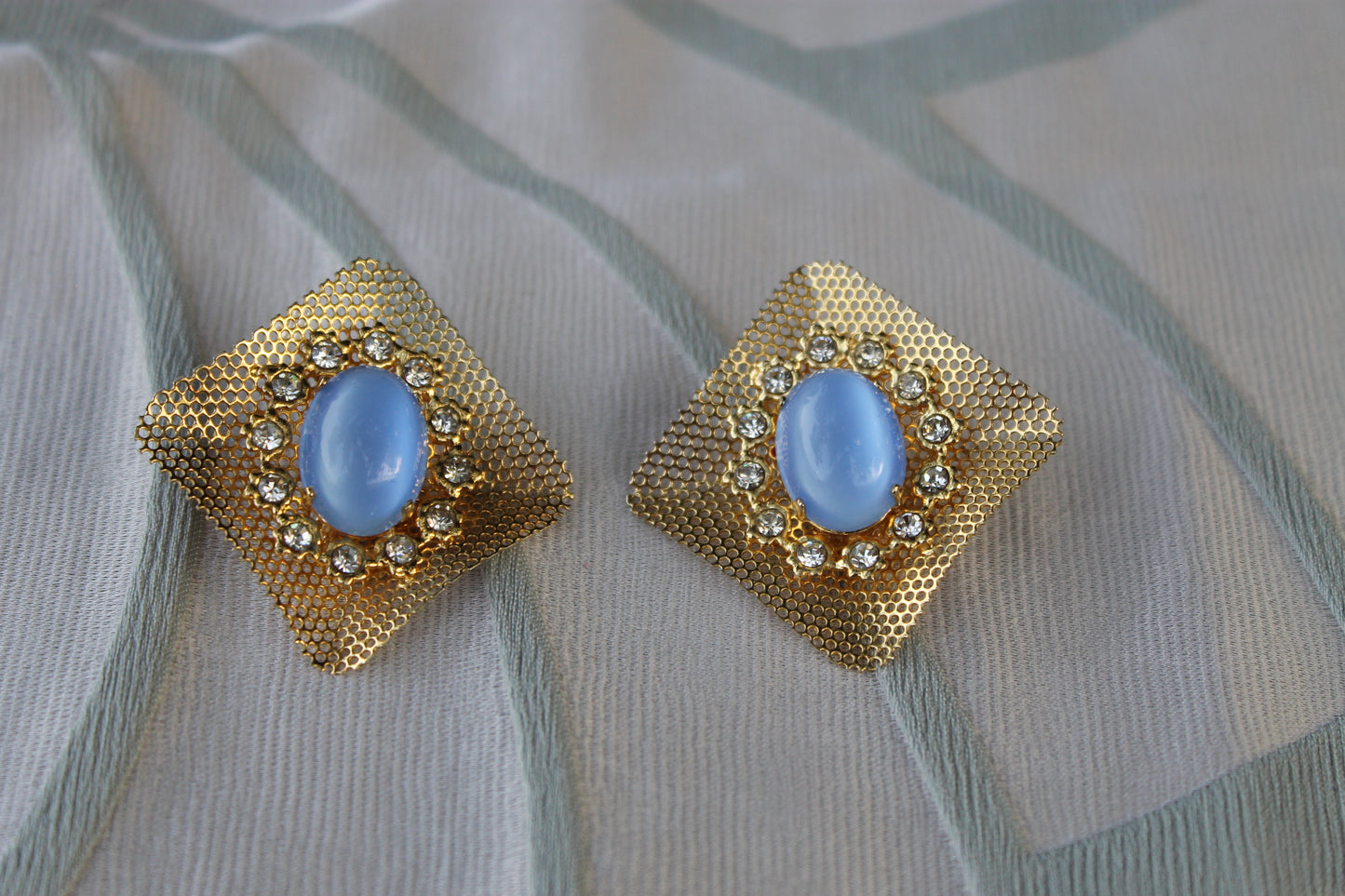Reticolo di Luce - Vintage 1960s gold-tone metal earrings with light blue cabochon