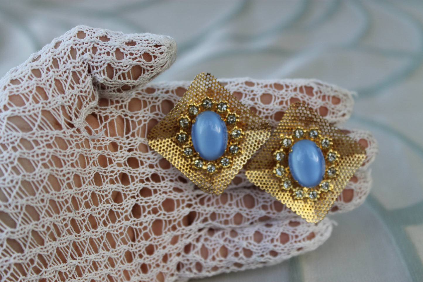 Reticolo di Luce - Vintage 1960s gold-tone metal earrings with light blue cabochon