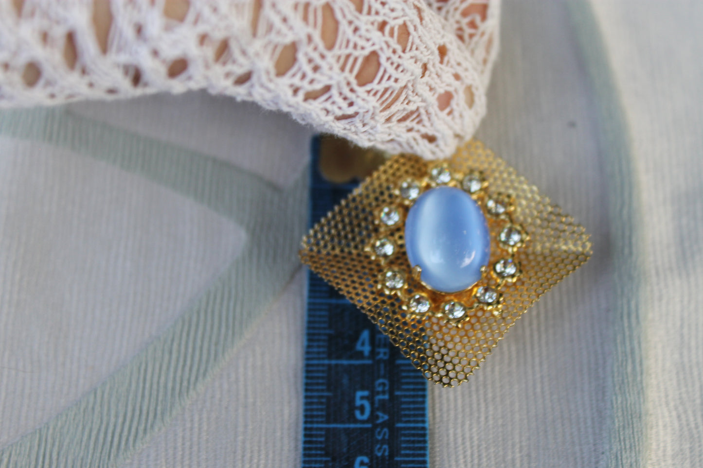 Reticolo di Luce - Vintage 1960s gold-tone metal earrings with light blue cabochon
