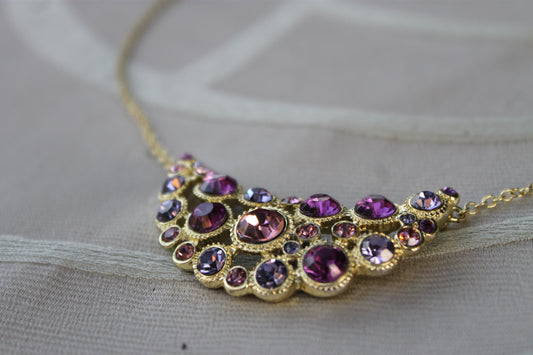 Lacrime di Aurora - Avon necklace in golden metal with pink and purple crystals