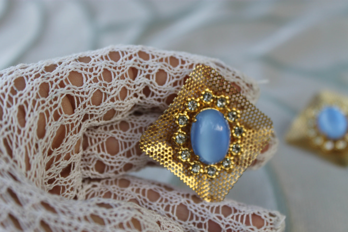 Reticolo di Luce - Vintage 1960s gold-tone metal earrings with light blue cabochon