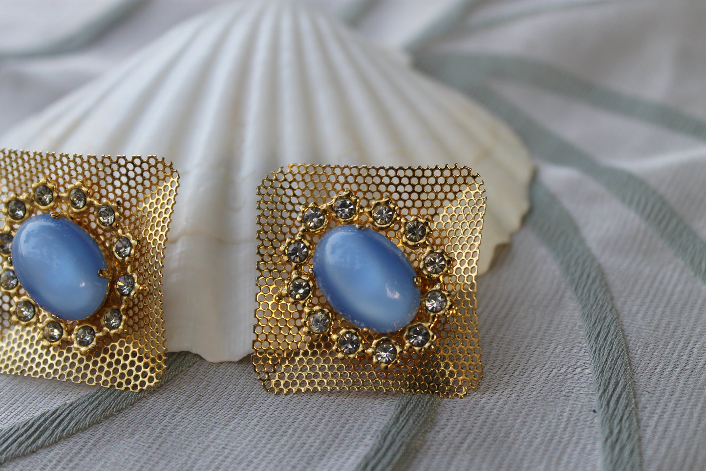 Reticolo di Luce - Vintage 1960s gold-tone metal earrings with light blue cabochon